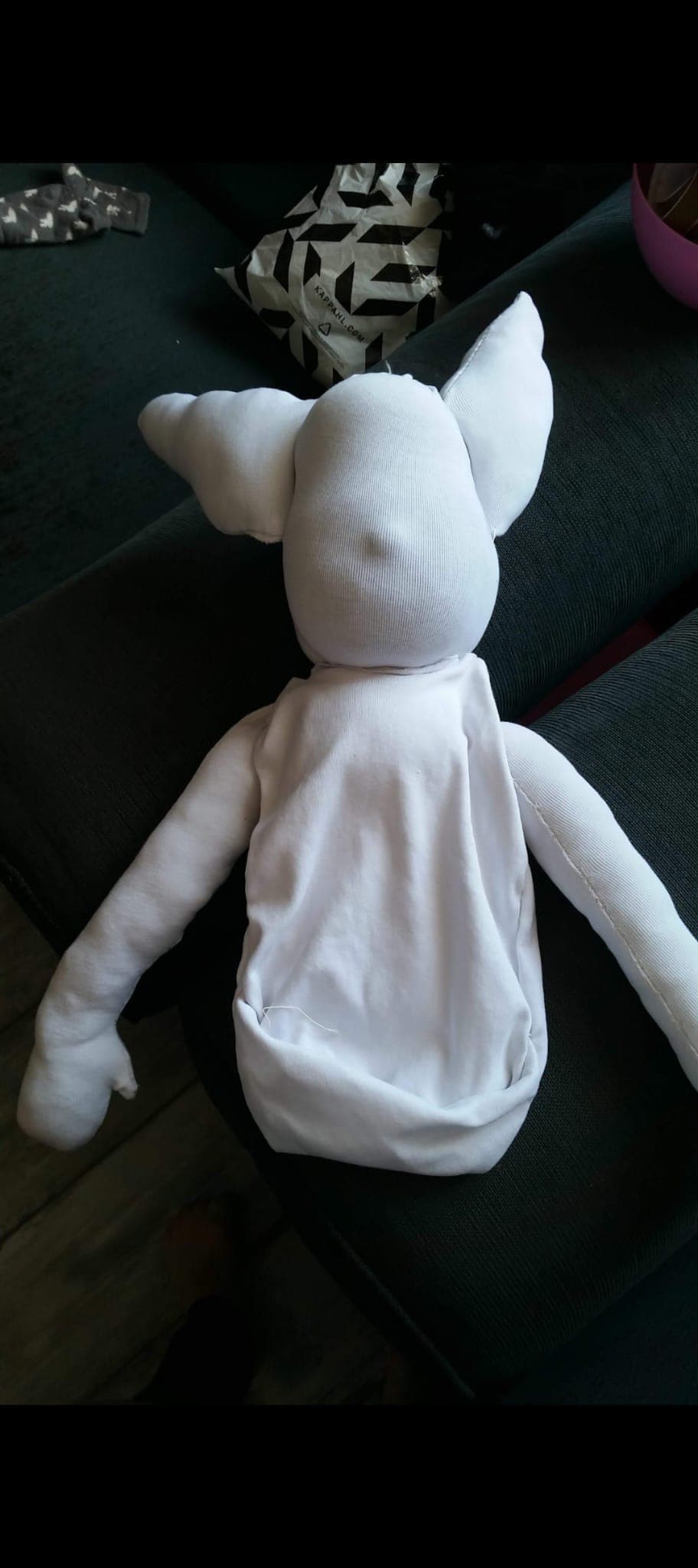 Handmade Blume doll on a couch