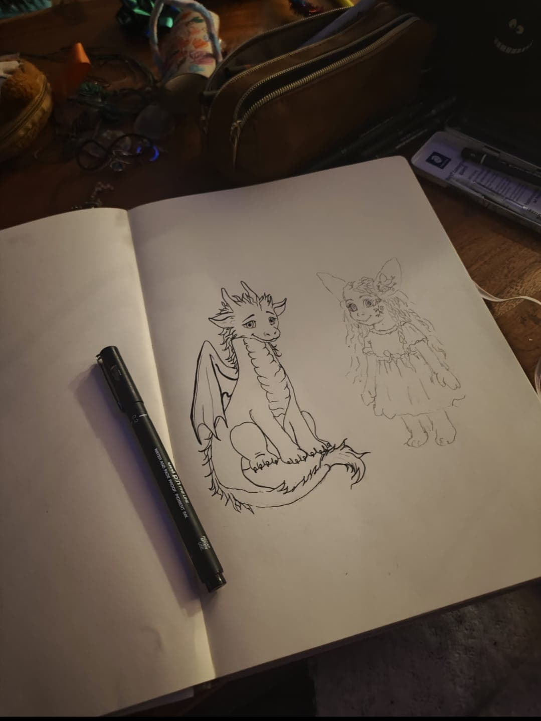 Pencil sketches of Florenz and Blume at the workbench
